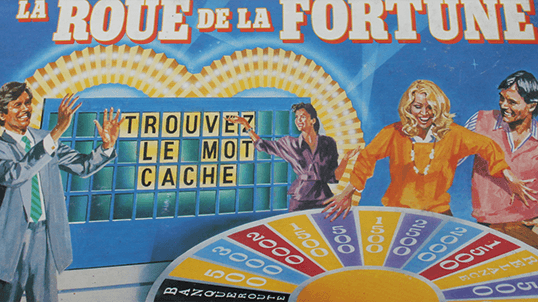 une illustration sur la boite du jeu de societe la roue de la fortune